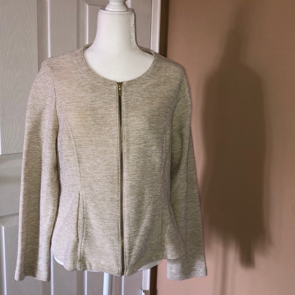 “Gladys” is wearing a Zippered form fitting blazer